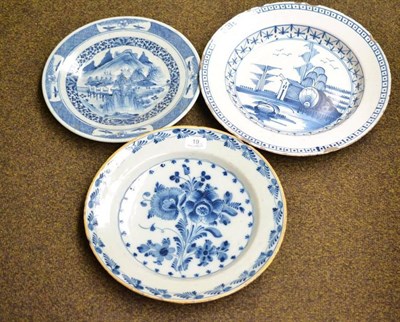 Lot 19 - Two tin glazed earthenware dishes, decorated with a landscape and flowers; and a Japanese blue...