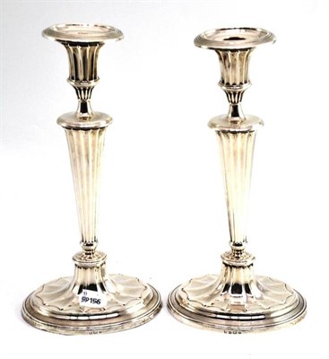 Lot 24 - A pair of Adams style silver candlesticks, Birmingham 1917