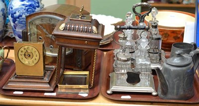 Lot 29 - A 1930's mahogany mantel clock; a four glass timepiece; two silver plated condiment stands; tankard