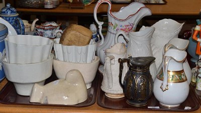 Lot 39 - Two trays of Victorian water jugs; Jasperware jardiniere; jelly moulds; Hovis money box; and a...