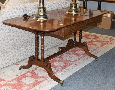 Lot 1398 - A Regency Mahogany Sofa Table, cross banded...