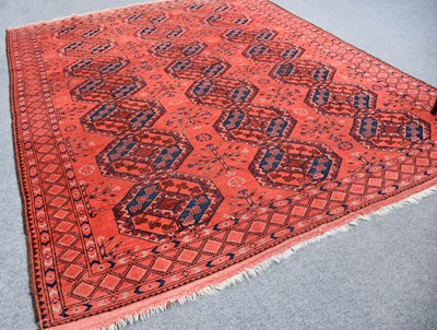 Lot 1090 - Afghan Carpet, the field with three columns of...