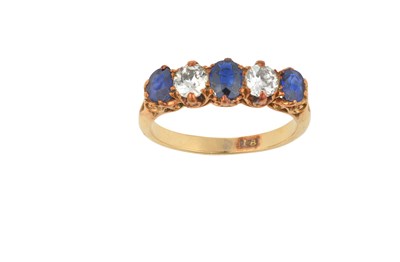 Lot 2412 - A Synthetic Sapphire and Diamond Five Stone...