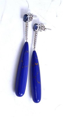 Lot 67 - A pair of sapphire, diamond and lapis lazuli type drop earrings, an oval cut sapphire suspends...