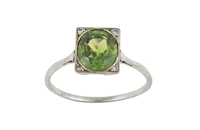 Lot 2459 - A Green Garnet Ring the oval cut green garnet...