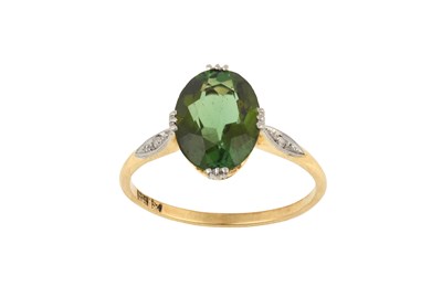 Lot 2287 - A Green Tourmaline Ring the oval cut green...