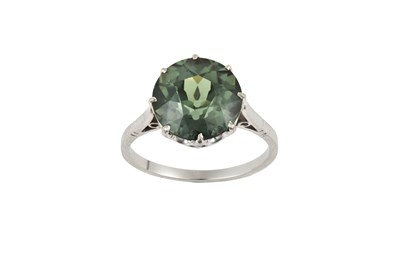 Lot 2422 - A Green Zircon Ring the round cut green zircon...