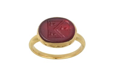 Lot 2027 - A Red Glass Signet Ring
