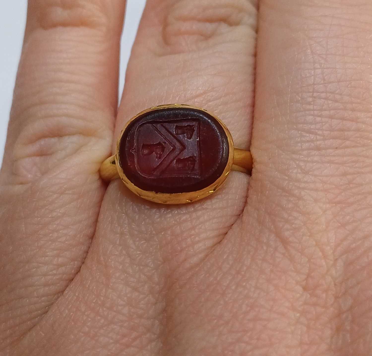 Lot 2027 - A Red Glass Signet Ring,
