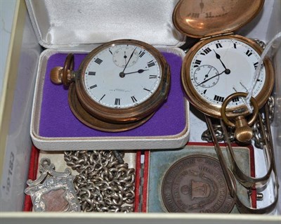 Lot 85 - Two gold plated full hunter pocket watches, two silver sugar tongs, silver fob, medallion,...