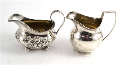 Lot 94 - Two silver cream jugs