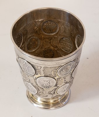Lot 2056 - A German Parcel-Gilt Silver Coin-Set Beaker (Munzbecher)
