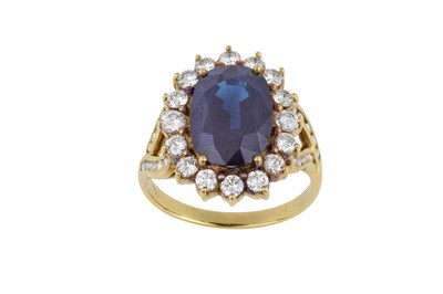 Lot 2249 - A Sapphire and Diamond Cluster Ring the oval...