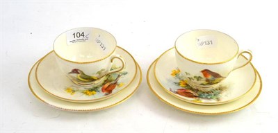 Lot 104 - Two Royal Worcester Trios, painted by W Powell with bird studies, including green woodpecker,...