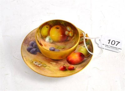 Lot 107 - Royal Worcester fruit painted miniature cup and saucer