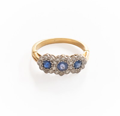Lot 282 - An 18 Carat Gold Sapphire and Diamond Triple...