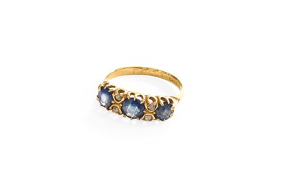Lot 254 - A Sapphire and Diamond Ring, three round cut...