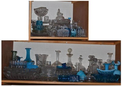 Lot 119 - Two shelves of clear and blue glass including pressed glass, decanters, rinsers, etc