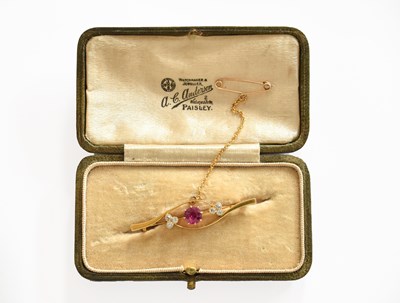Lot 279 - A Ruby and Diamond Brooch, the round cut ruby...