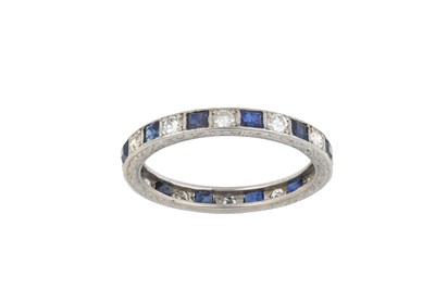 Lot 2431 - A Sapphire and Diamond Eternity Ring calibré...