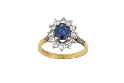 Lot 2337 - An 18 Carat Gold Sapphire and Diamond Cluster...