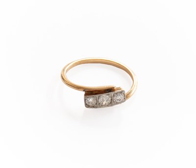 Lot 276 - A Diamond Three Stone Twist Ring, the old cut...