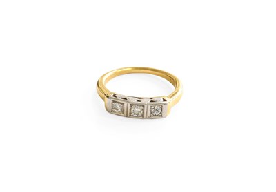 Lot 248 - A Diamond Three Stone Ring, the graduated...