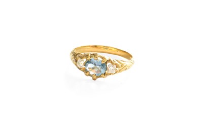 Lot 275 - An Aquamarine and Diamond Ring, the oval cut...