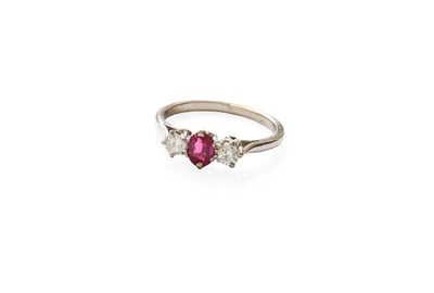 Lot 247 - A Synthetic Ruby and Diamond Three Stone Ring,...