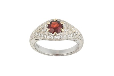 Lot 2375 - A Garnet and Diamond Ring the raised round cut...