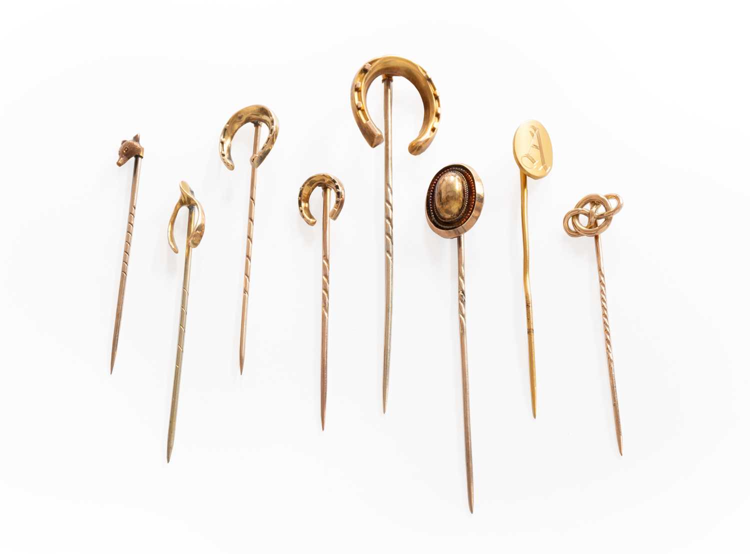 Lot 251 - Eight Stick Pins, of varying designs,