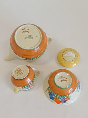 Lot 569 - A Clarice Cliff Crocus Bizarre Globe Tea Set,...