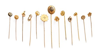 Lot 269 - Thirteen Diamond Stick Pins, of varying...