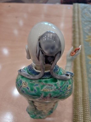 Lot 29 - A Chinese Porcelain Figure of an Immortal,...