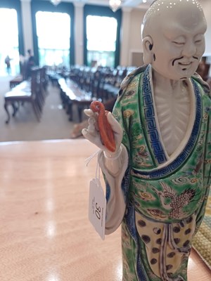 Lot 29 - A Chinese Porcelain Figure of an Immortal,...