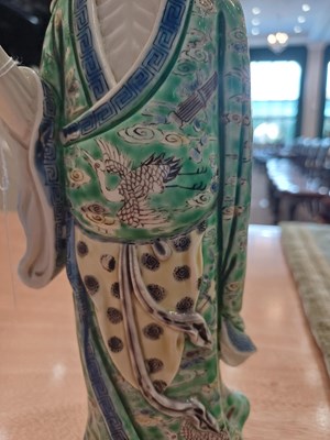 Lot 29 - A Chinese Porcelain Figure of an Immortal,...