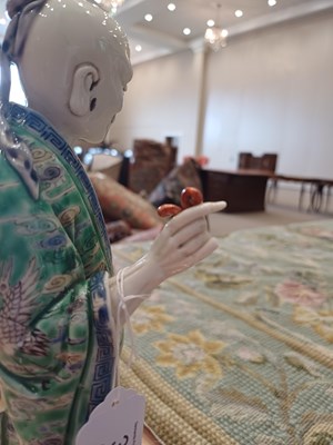 Lot 29 - A Chinese Porcelain Figure of an Immortal,...
