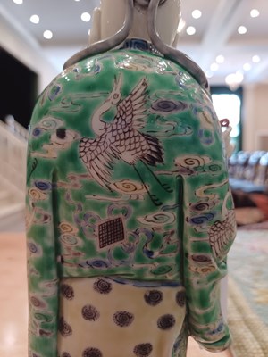 Lot 29 - A Chinese Porcelain Figure of an Immortal,...