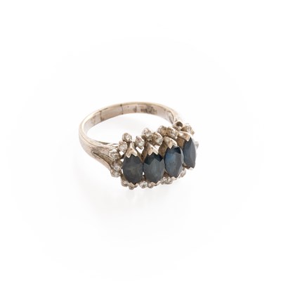 Lot 281 - A Sapphire and Diamond Cluster Ring, four...