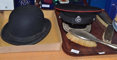 Lot 171 - Three silver backed dressing table items, a bowler hat and a military hat (3)