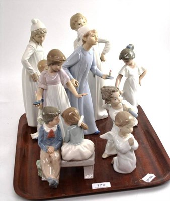 Lot 179 - Two Lladro figures of cherubs; and six Nao figures and groups (8)