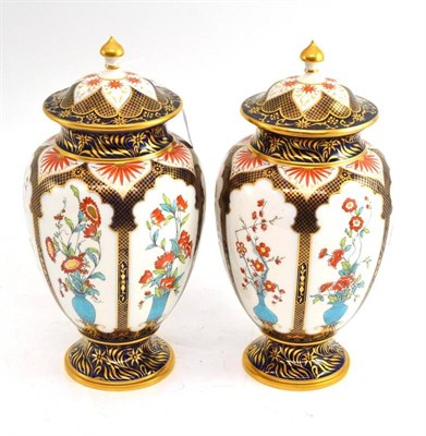 Lot 181 - A pair of late 19th century Royal Worcester vases and covers, decorated in the Imari palette,...