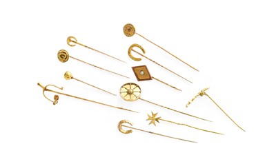Lot 238 - Eleven Stick Pins, of varying designs,...