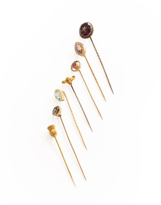 Lot 273 - Seven Stick Pins, including a sapphire example,...