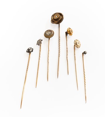 Lot 260 - Seven Diamond Stick Pins, of varying design,...