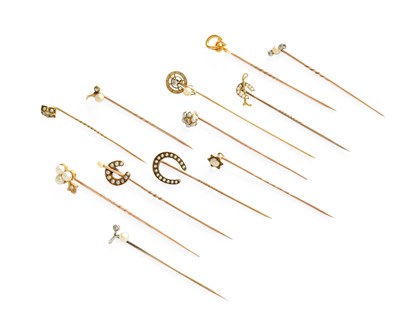 Lot 232 - Twelve Stick Pins, of varying design,...