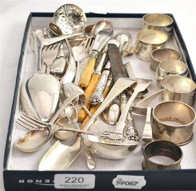 Lot 220 - A collection of assorted silver including baby pushers, napkin rings, stilton scoops, sifter spoon