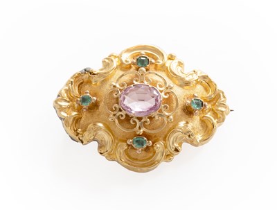 Lot 262 - A Pink Topaz and Emerald Brooch, the oval cut...