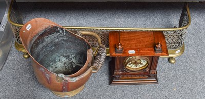 Lot 1268 - A 19th Century Brass Fender; a copper helmet...