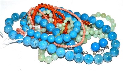 Lot 240 - A blue bead necklace with matching earrings and bracelet; and three other necklaces